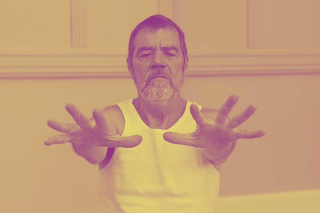 Man practicing the Pawanamuktasana sequence online