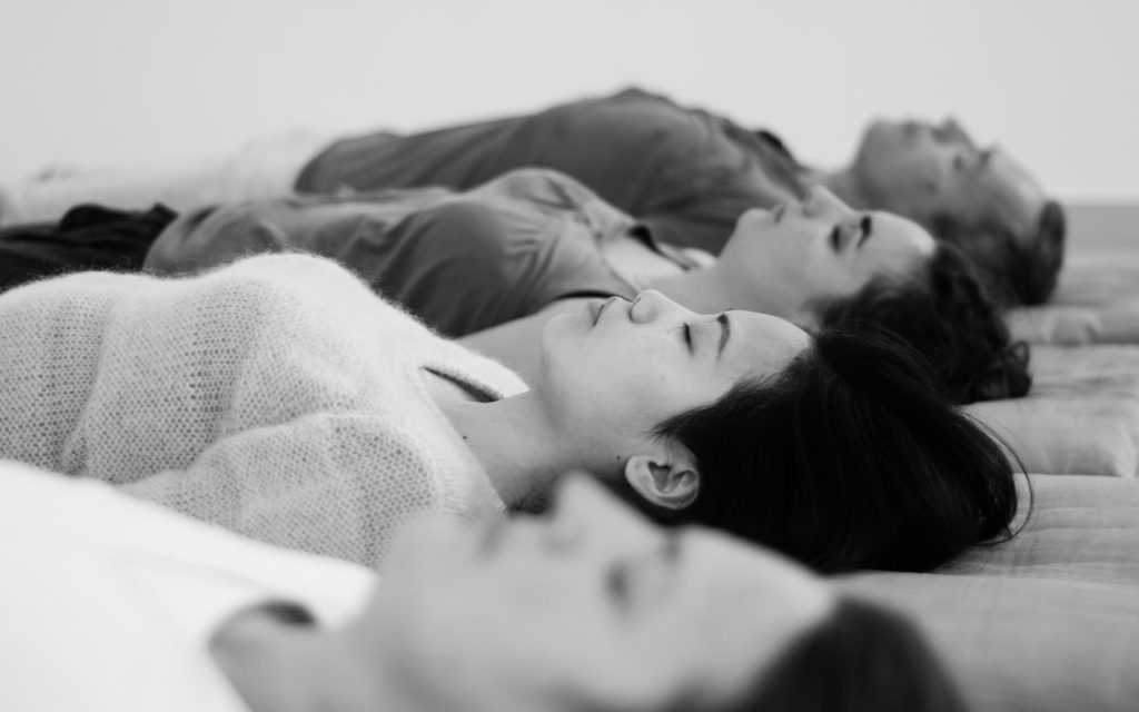 Yoga nidra is practiced lying down in savasana. It is an excellent relaxation technique that is part of all our sessions.