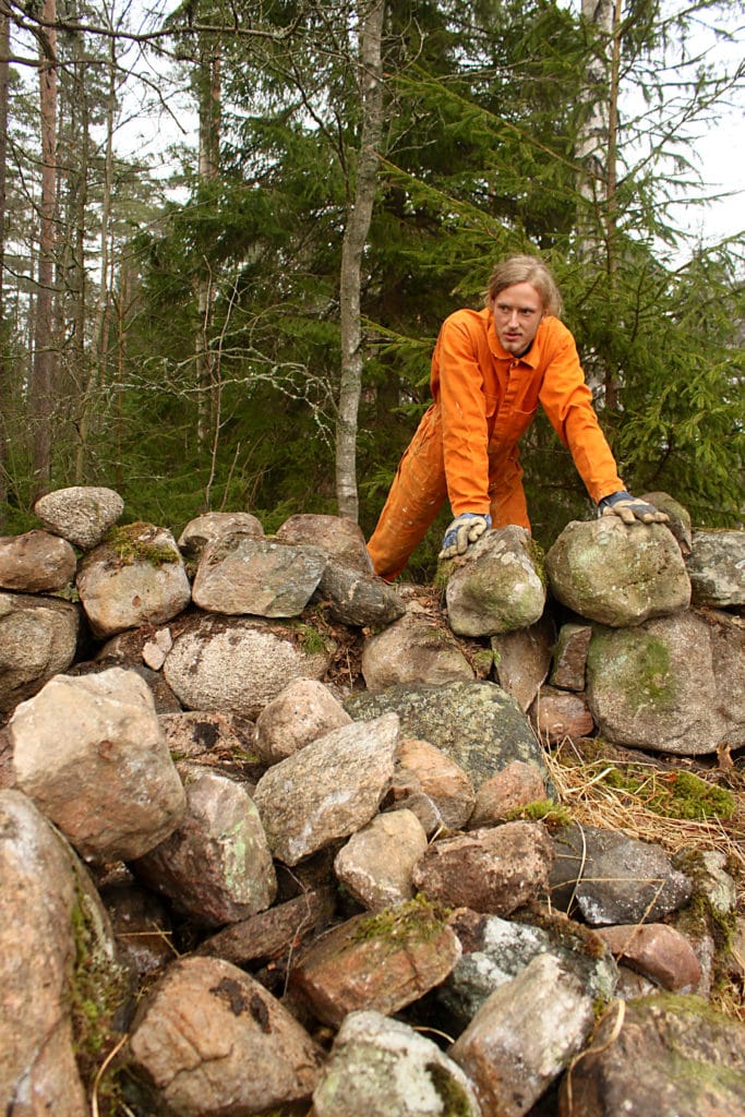 Karma yoga on the stone wall.