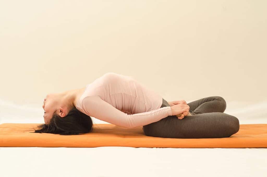 Matsyasana in the lotus pose