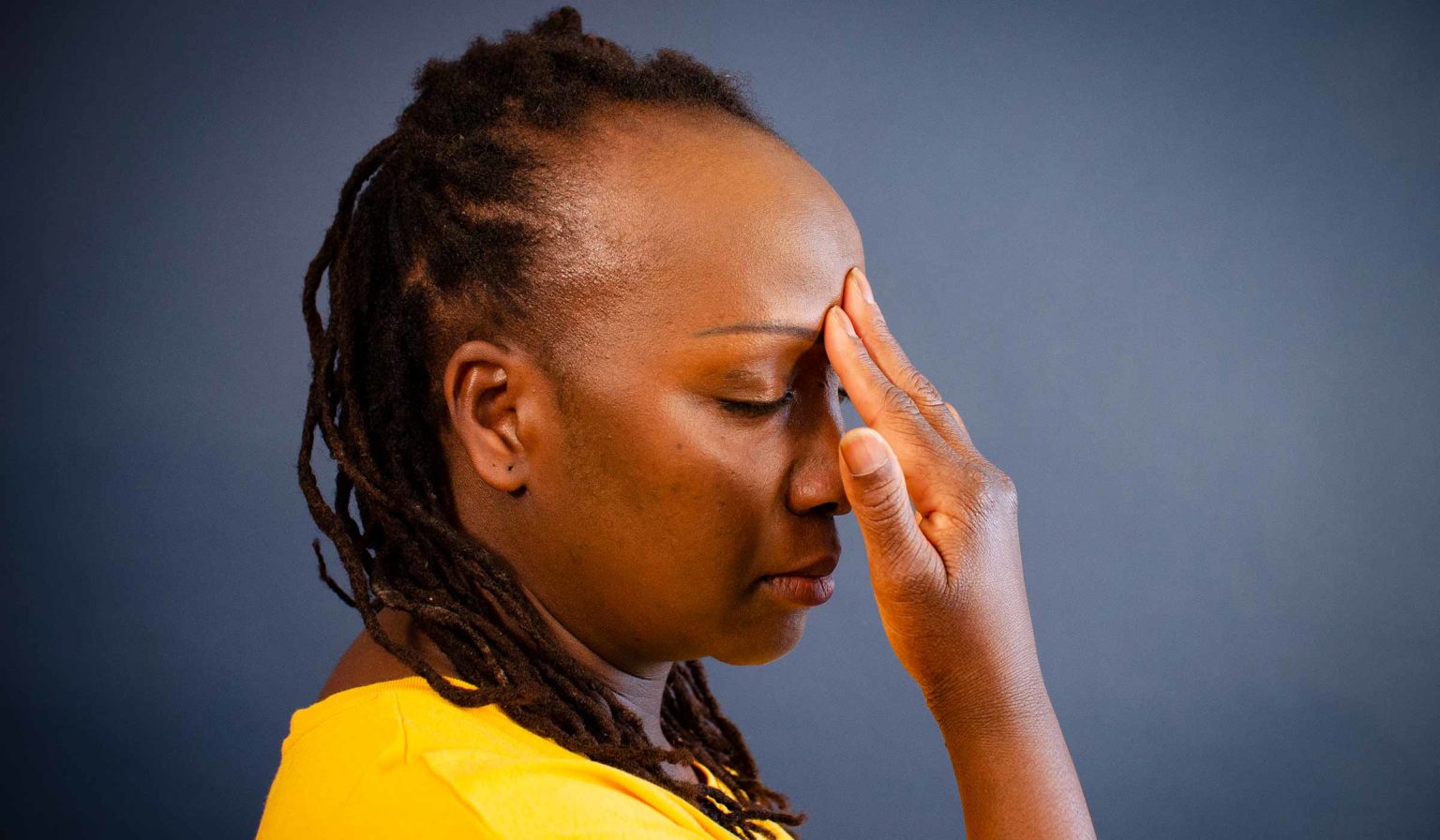 Woman who respects the right order to do pranayama by practicing Nadi Shodana in the end of a session.