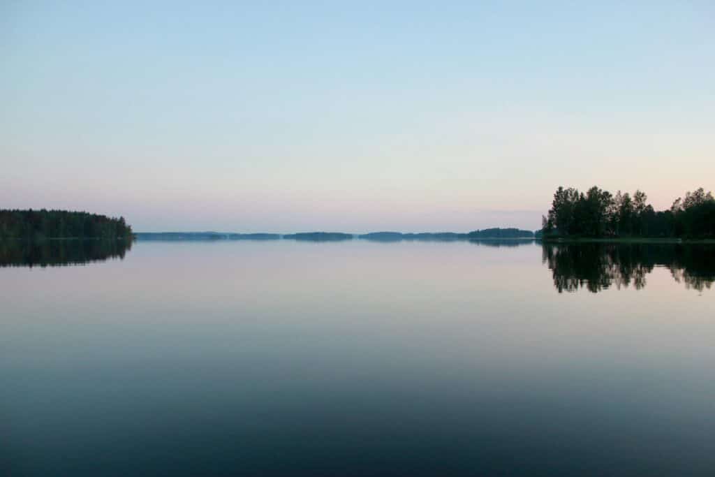 A lake with calm waters. A symbolic image for a calm mind that could become a vision during meditation.