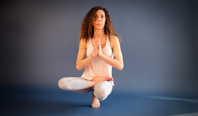 Woman in balancing yoga pose